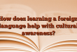 How does learning a foreign language help with cultural awareness?